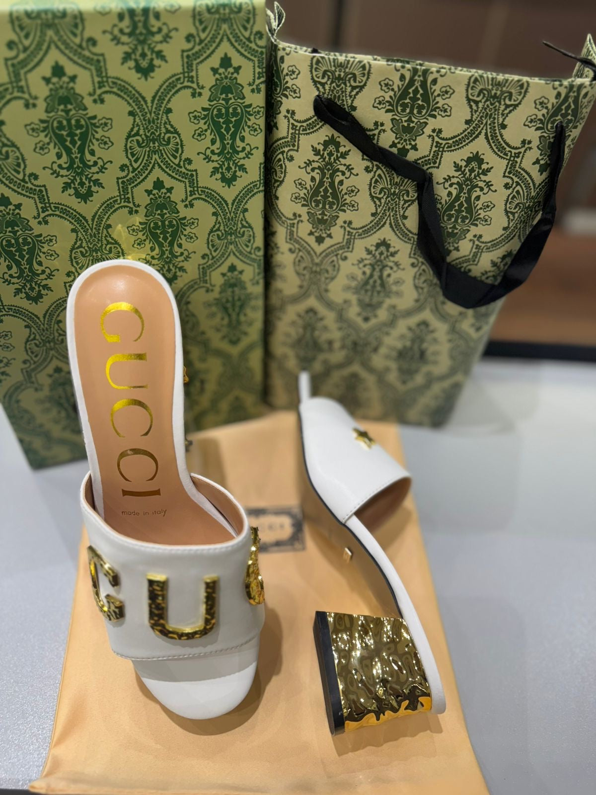 GUCCI Matelassé Heeled Sandals – Gold-Tone Logo | White & Black