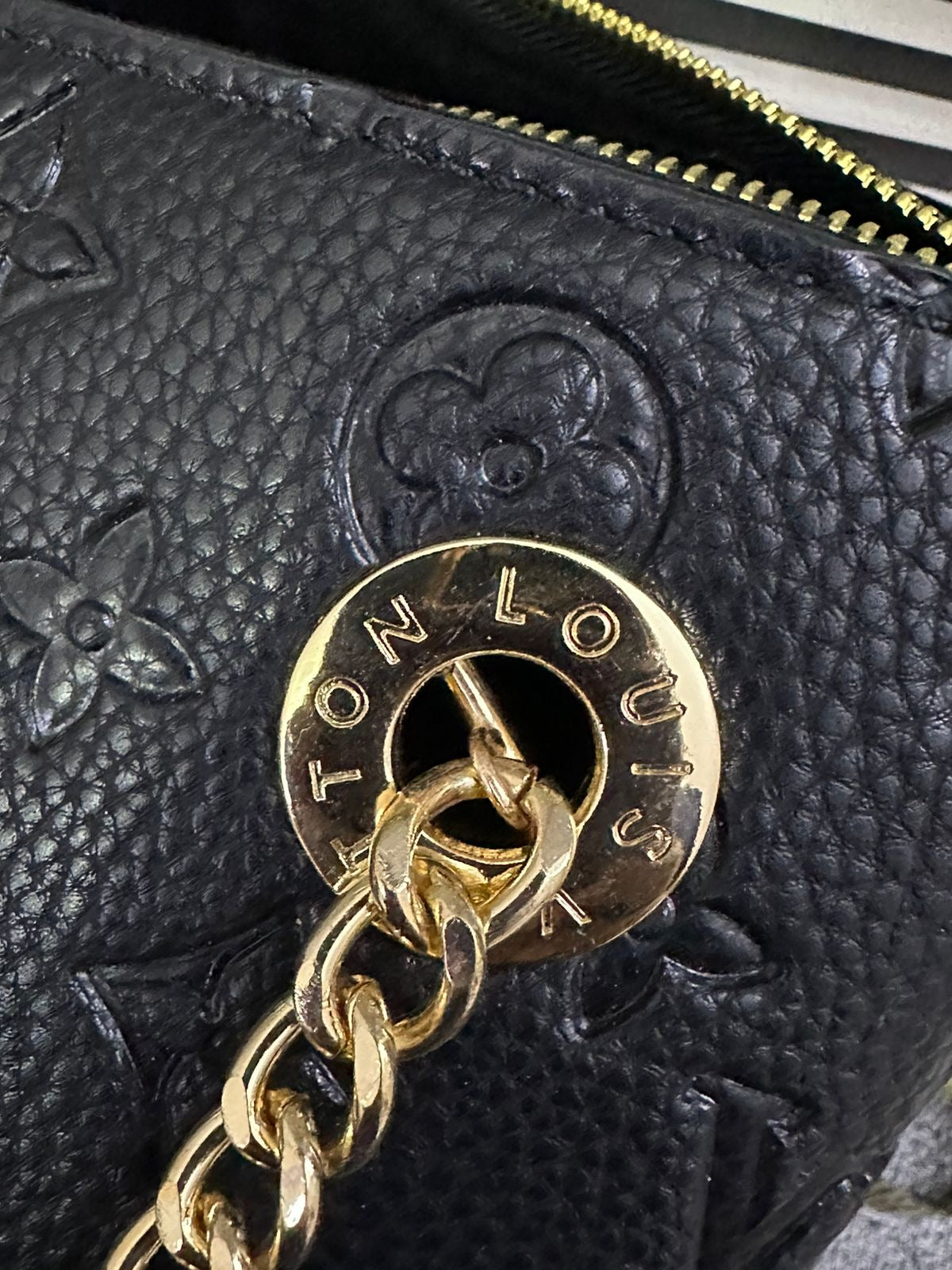 LOUIS VUITTON
Surene MM Monogram Empreinte Leather