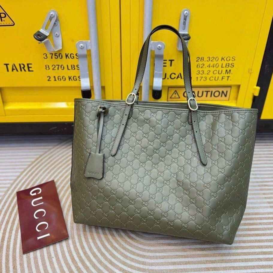 Gucci GG Emblem Debossed Leather Tote Bag