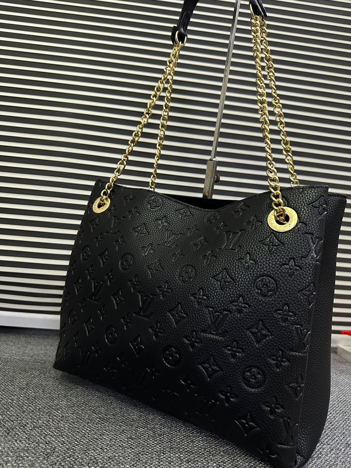 LOUIS VUITTON
Surene MM Monogram Empreinte Leather