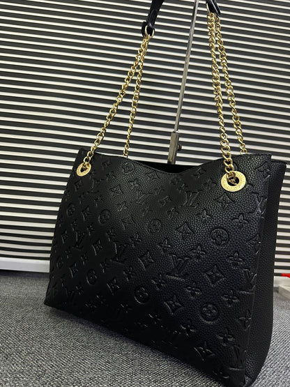 LOUIS VUITTON
Surene MM Monogram Empreinte Leather