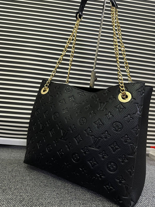 LOUIS VUITTON
Surene MM Monogram Empreinte Leather