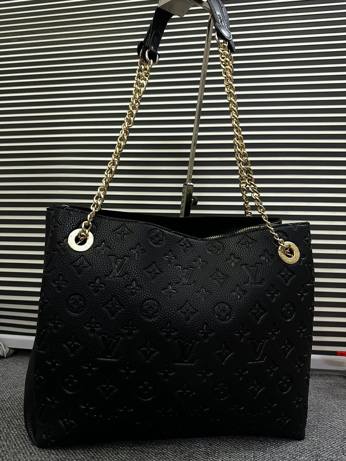 LOUIS VUITTON
Surene MM Monogram Empreinte Leather