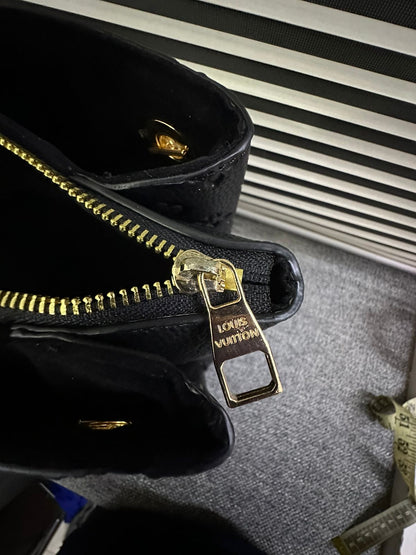 LOUIS VUITTON
Surene MM Monogram Empreinte Leather