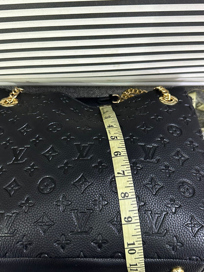 LOUIS VUITTON
Surene MM Monogram Empreinte Leather