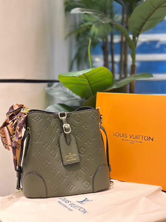 Louis Vuitton Green Embossed Leather Handbag with Monogram Pattern