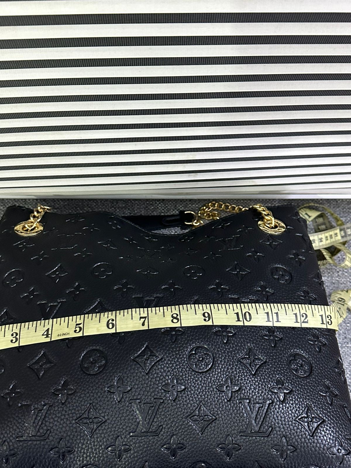 LOUIS VUITTON
Surene MM Monogram Empreinte Leather