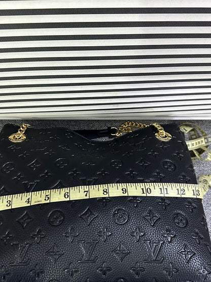 LOUIS VUITTON
Surene MM Monogram Empreinte Leather
