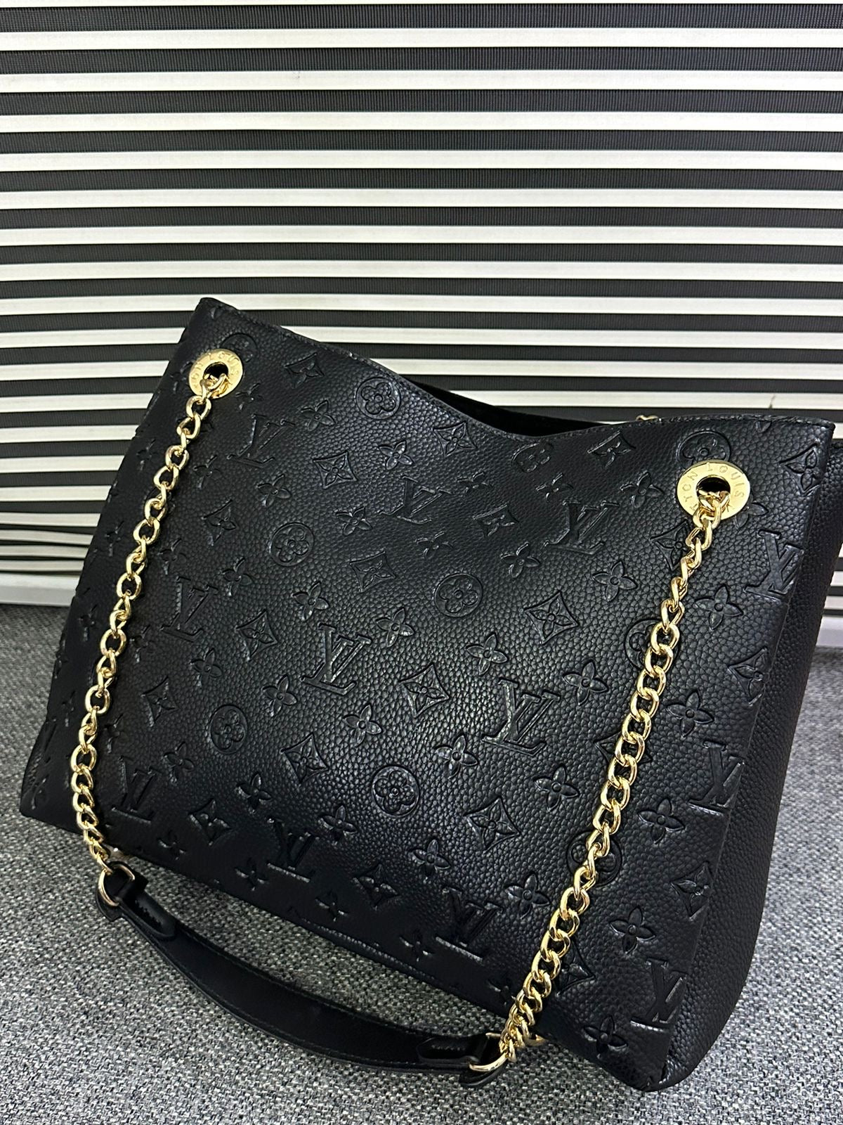 LOUIS VUITTON
Surene MM Monogram Empreinte Leather