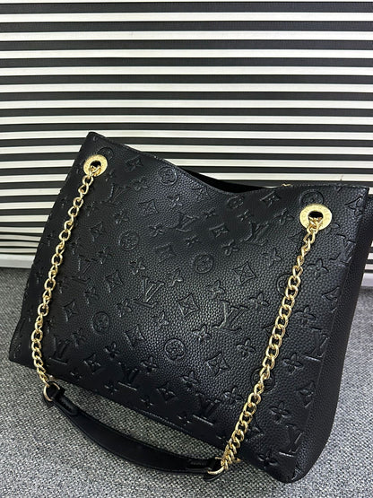 LOUIS VUITTON
Surene MM Monogram Empreinte Leather